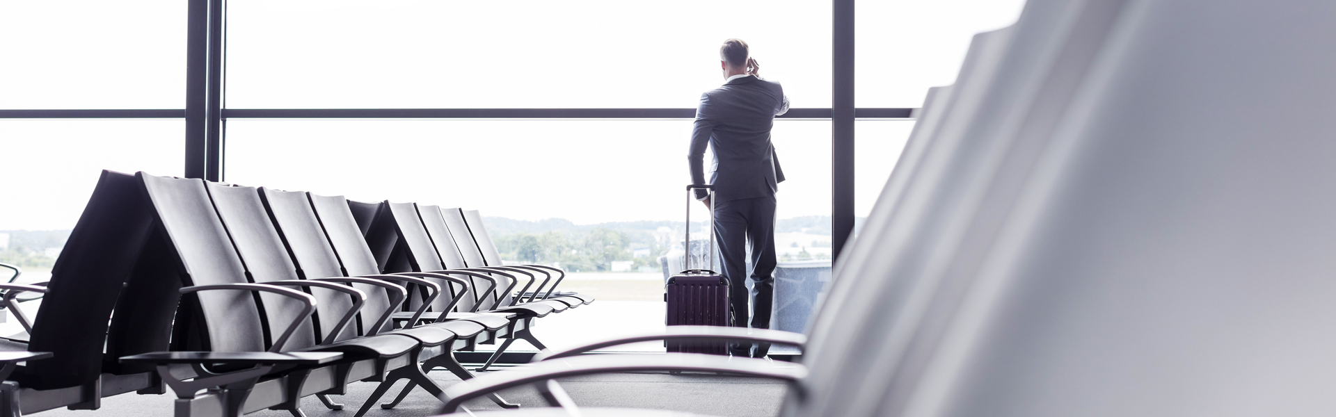 Man on the phone in an airport 