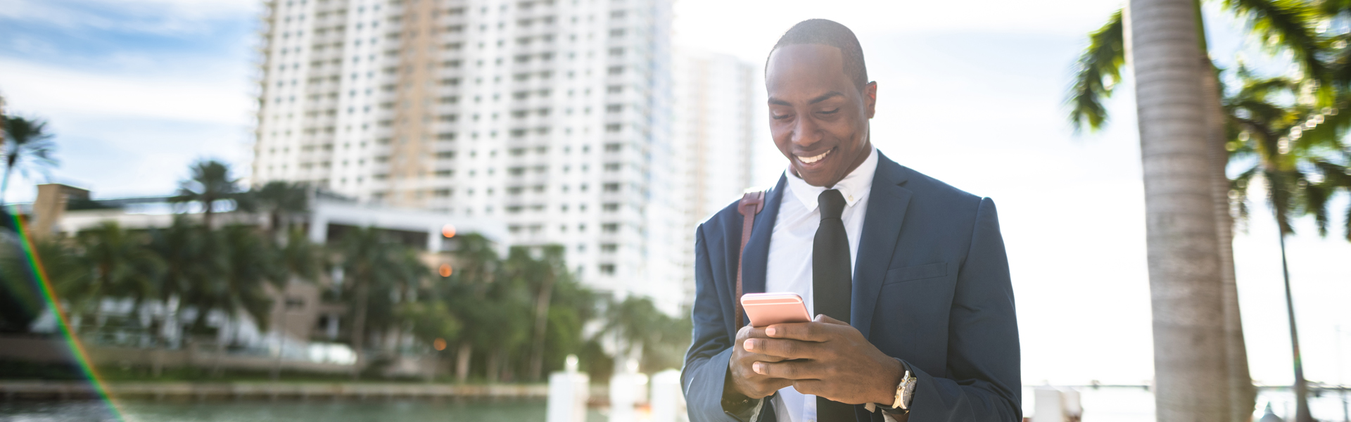 Business man looking at his phone