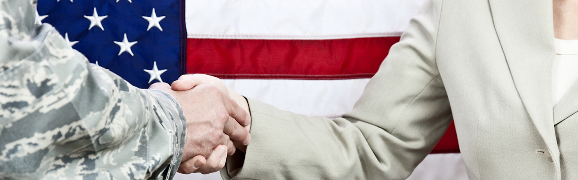 Handshake in front of American flag
