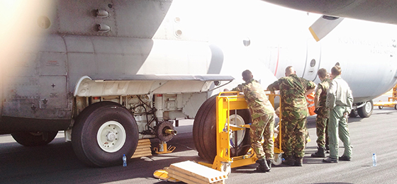 military-personnel-standing-before-plane