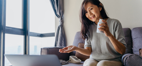 Asian woman using telehealth