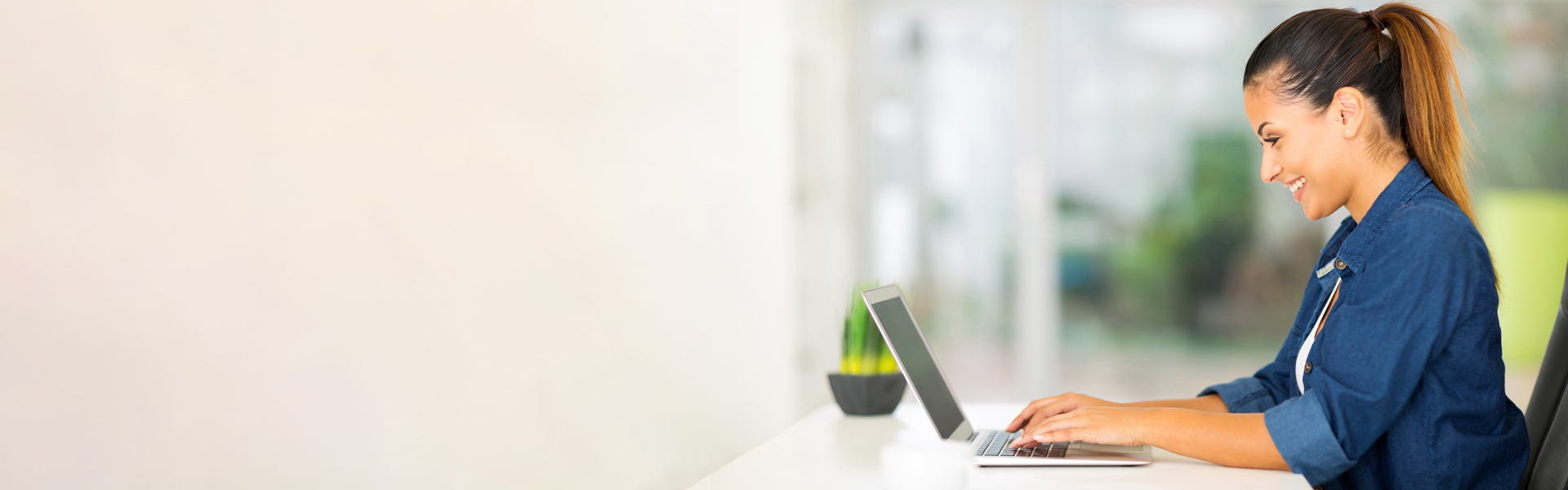 Woman typing on computer